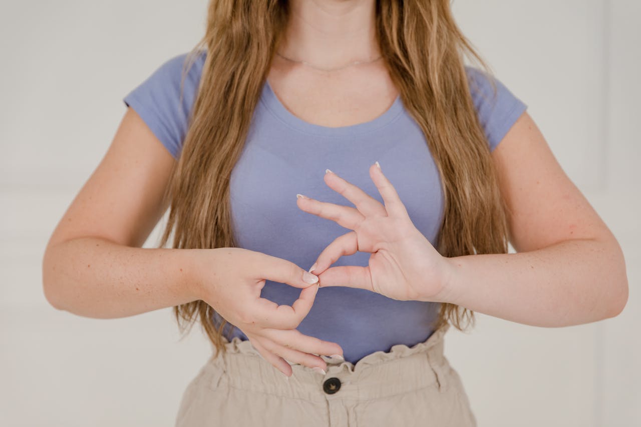 Close up on Woman's Hands while Using Sign Language for interpreter