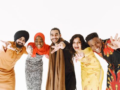 People in Traditional Clothing Smiling.