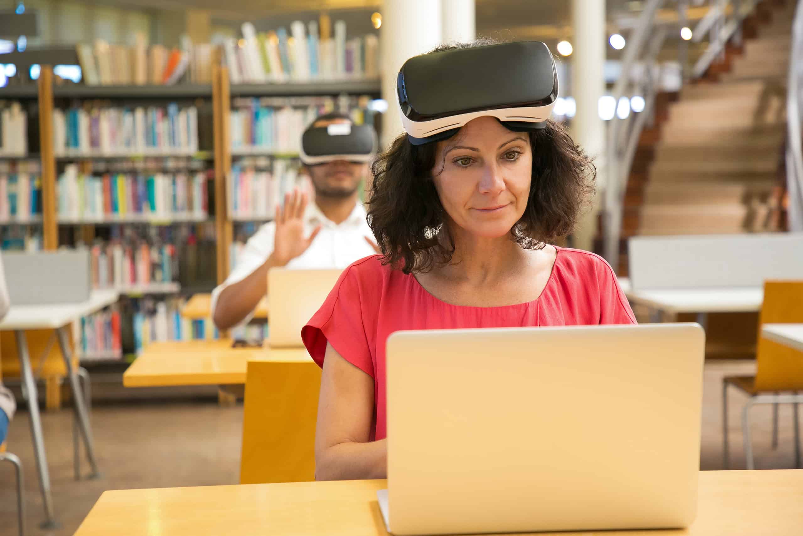 Front view of cheerful Caucasian woman setting VR headset.