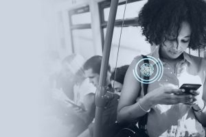 Young woman texting in a subway.
