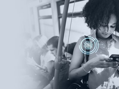 Young woman texting in a subway.