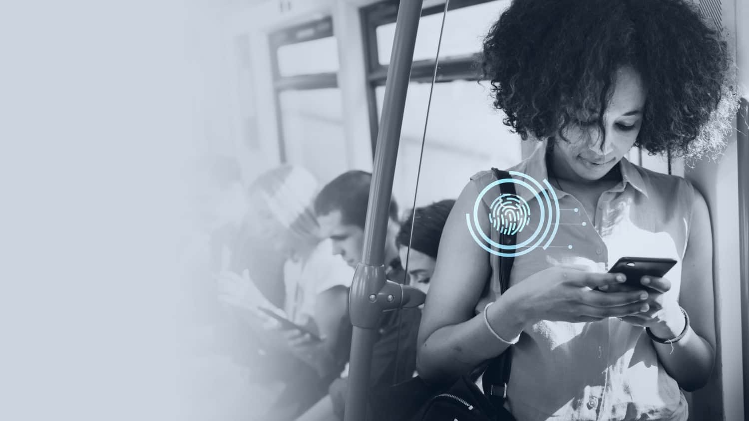Young woman texting in a subway.