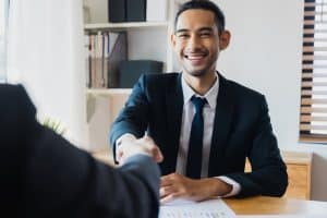 successful negotiate and handshake concept, two businessman shake hand with partner to celebration partnership and teamwork, business deal.