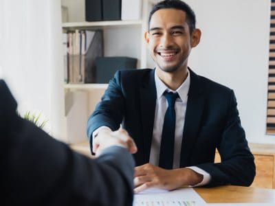 successful negotiate and handshake concept, two businessman shake hand with partner to celebration partnership and teamwork, business deal.
