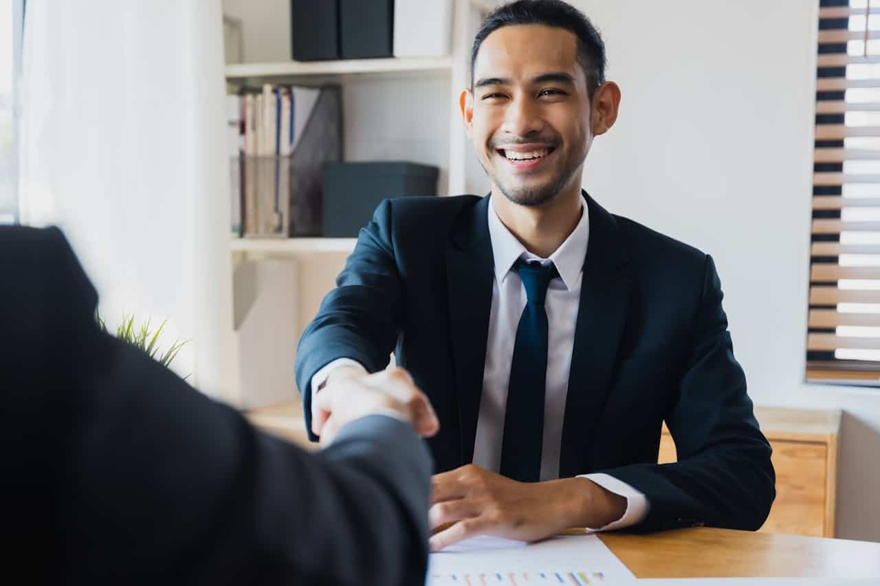 successful negotiate and handshake concept, two businessman shake hand with partner to celebration partnership and teamwork, business deal.