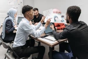 A People Looking the Documents Together.