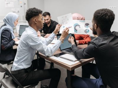 A People Looking the Documents Together.