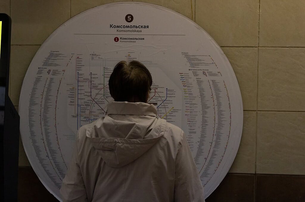 A Man Reading the Map of Moscow in Komsomolskaya Metro Station.