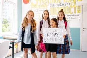 A Four Happy Girls in the Classroom