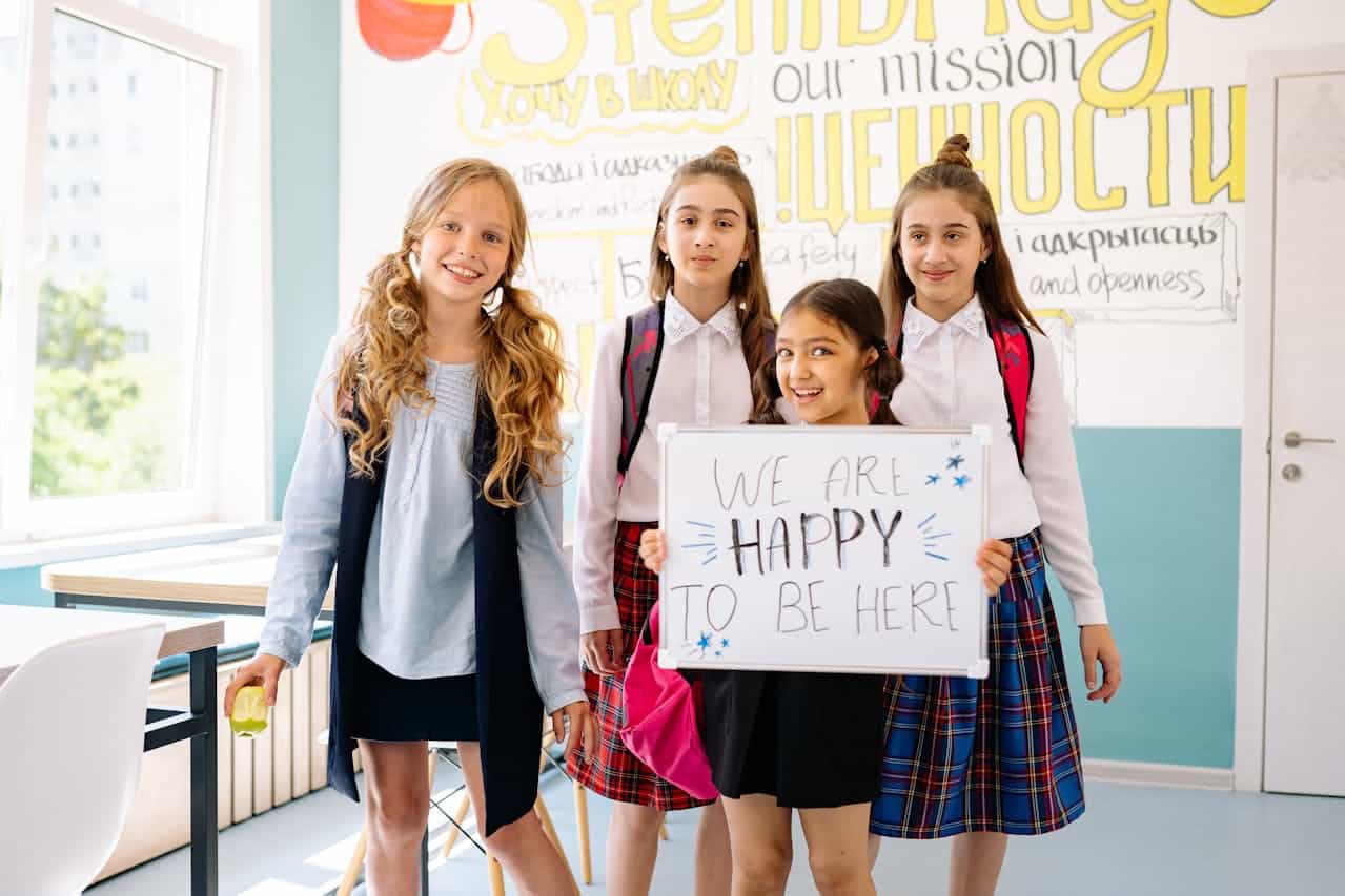 A Four Happy Girls in the Classroom